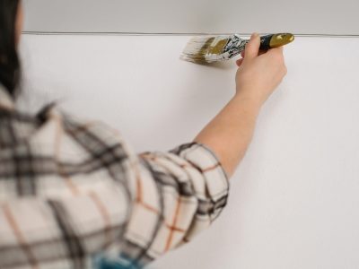 woman-painting-a-wall-with-white-paint-2022-08-01-01-13-17-utc